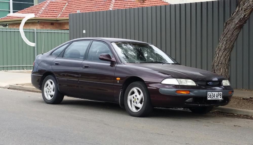 1992-1994_Ford_Telstar_TX5_(AX)_Ghia_hatchback_(15007561124).jpg